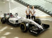 The newly announced Williams Martini Racing driver for the 2017 season Lance Stroll (L) poses for photographers with team-mate Valteri Bottas beside this year's Formula 1 car at their base in Wantage, Britain November 3, 2016. REUTERS/Eddie Keogh