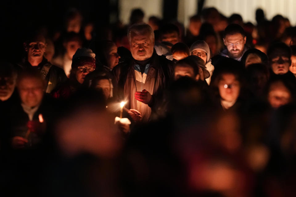 Orthodox believers walk with candles around a church during Orthodox Easter midnight service in St. Petersburg, Russia, Sunday, May 5, 2024. Eastern Orthodox churches observe the ancient Julian calendar and this year celebrate Orthodox Easter on May 5. (AP Photo/Dmitri Lovetsky)