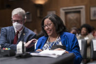 Marilyn Vann, president of the Descendants of Freedmen of the Five Tribes Association of Oklahoma City, talks with Stephen Greethman, left, counsel for the Chickasaw Nation, as they testify before the Senate Indian Affairs Committee about the status of the descendants of enslaved people formerly held by the Muscogee (Creek), Chickasaw, Choctaw, Seminole and Cherokee Nations, at the Capitol in Washington, Wednesday, July 27, 2022. (AP Photo/J. Scott Applewhite)