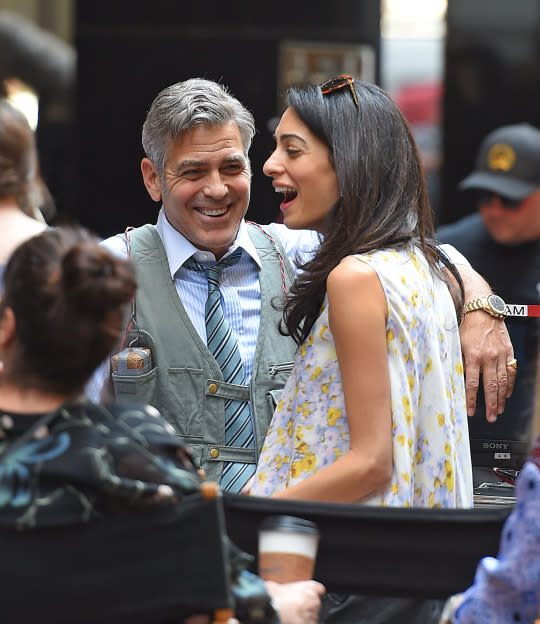 George and Amal Clooney laugh on the set of George's movie 'Money Monster' in April (Getty Images)