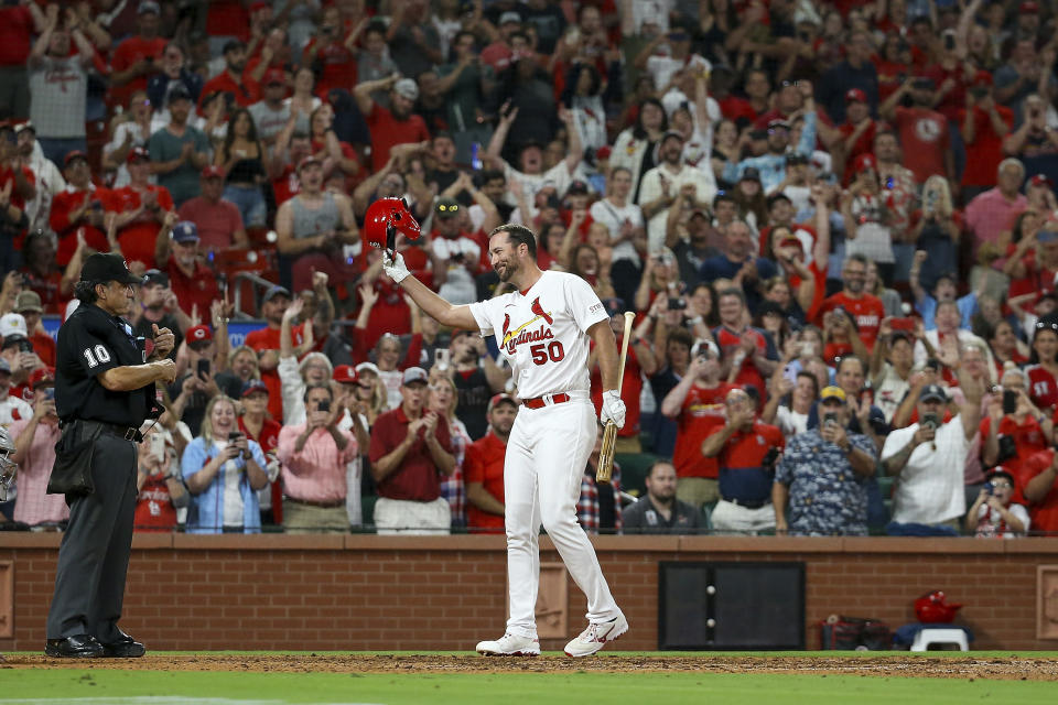 St. Louis Cardinals' Adam Wainwright acknowledges fans as he prepares to pinch hit during the sixth inning of a baseball game against the Cincinnati Reds, Friday, Sept. 29, 2023, in St. Louis. (AP Photo/Scott Kane)