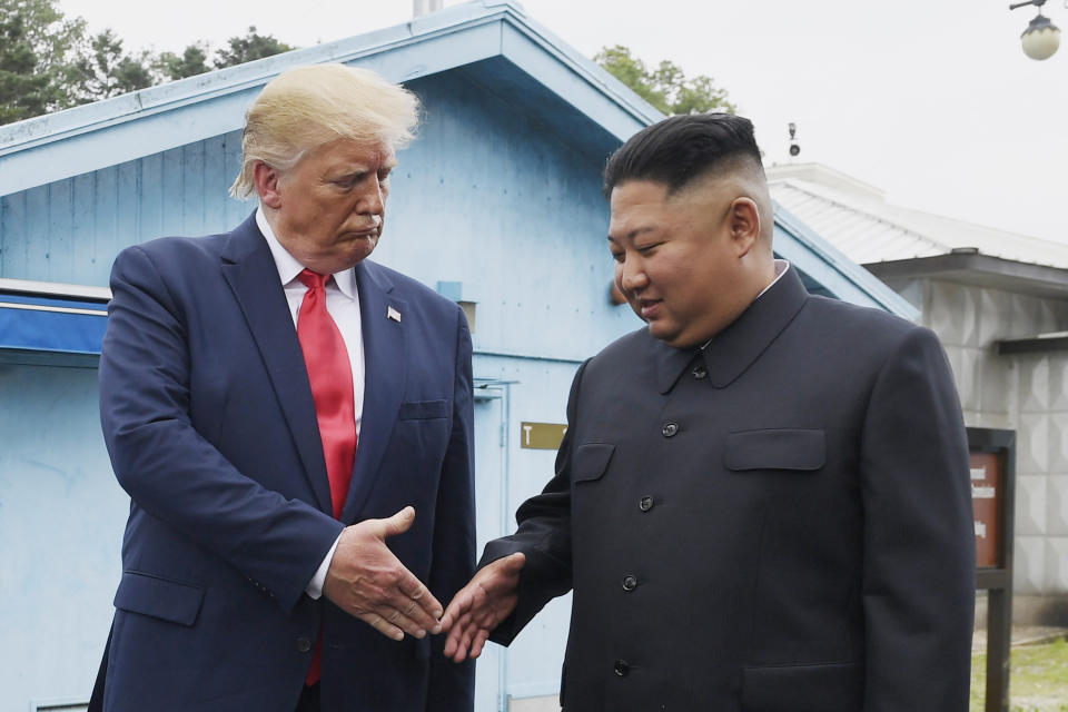 FILE - In this June 30, 2019, file photo, North Korean leader Kim Jong Un, right, and U.S. President Donald Trump prepare to shake hands at the border village of Panmunjom in the Demilitarized Zone, South Korea. Negotiations with Washington have been deadlocked for more than two years after he failed to win badly needed sanctions relief from Trump. President Joe Biden's administration seems in no hurry to cut a deal unless Kim shows a willingness to wind down his nuclear weapons program, a “treasured sword” he sees as his biggest guarantee of survival. (AP Photo/Susan Walsh, File)
