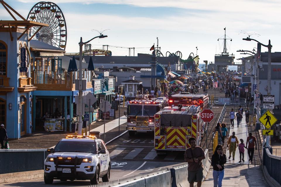 A police vehicle and fire trucks sit at Santa Monica Pier after a man, who claimed to have a bomb, climbed the ferris wheel and refused to come down, in Santa Monica, California, on October 09, 2023.