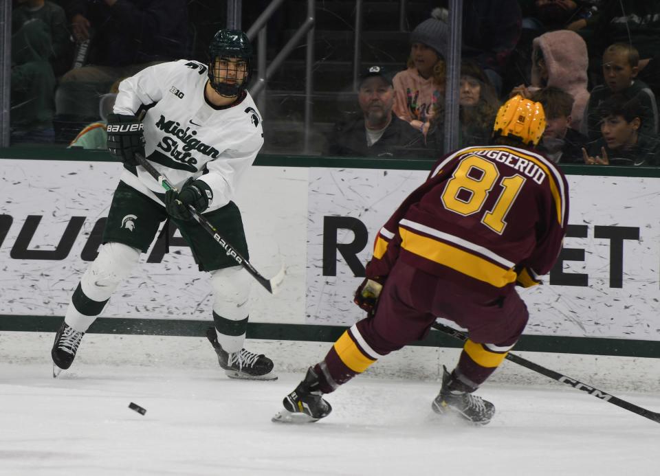 MSU's David Gucciardi moves the puck against Jimmy Snuggerud of Minnesota Friday, Dec. 2, 2022, at Munn Ice Arena in East Lansing.