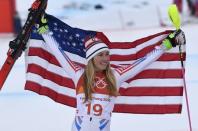 Alpine Skiing - Pyeongchang 2018 Winter Olympics - Women's Alpine Combined - Jeongseon Alpine Centre - Pyeongchang, South Korea - February 22, 2018 - Silver medallist Mikaela Shiffrin of the U.S. holds a flag as she celebrates. REUTERS/Toby Melville