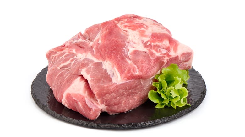 raw pork shoulder white background 