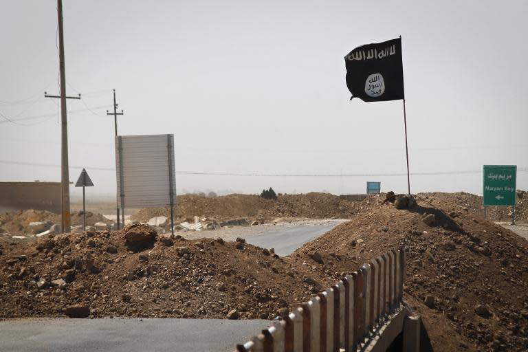 A flag of the Islamic State (IS) is seen in Rashad, Iraq, on September 11, 2014