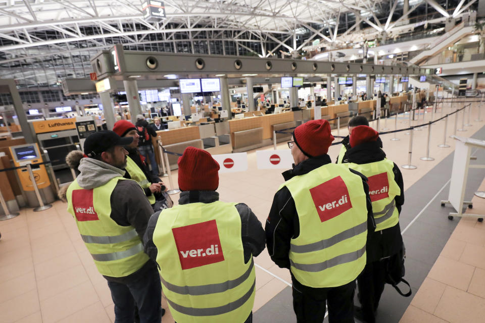 Members of the security staff are on strike at the airport in Hamburg, Germany, Tuesday, Jan. 15, 2019. Flights across Germany are facing disruption after security staff at eight airports went on strike over pay. (Christian Charisius/dpa via AP)