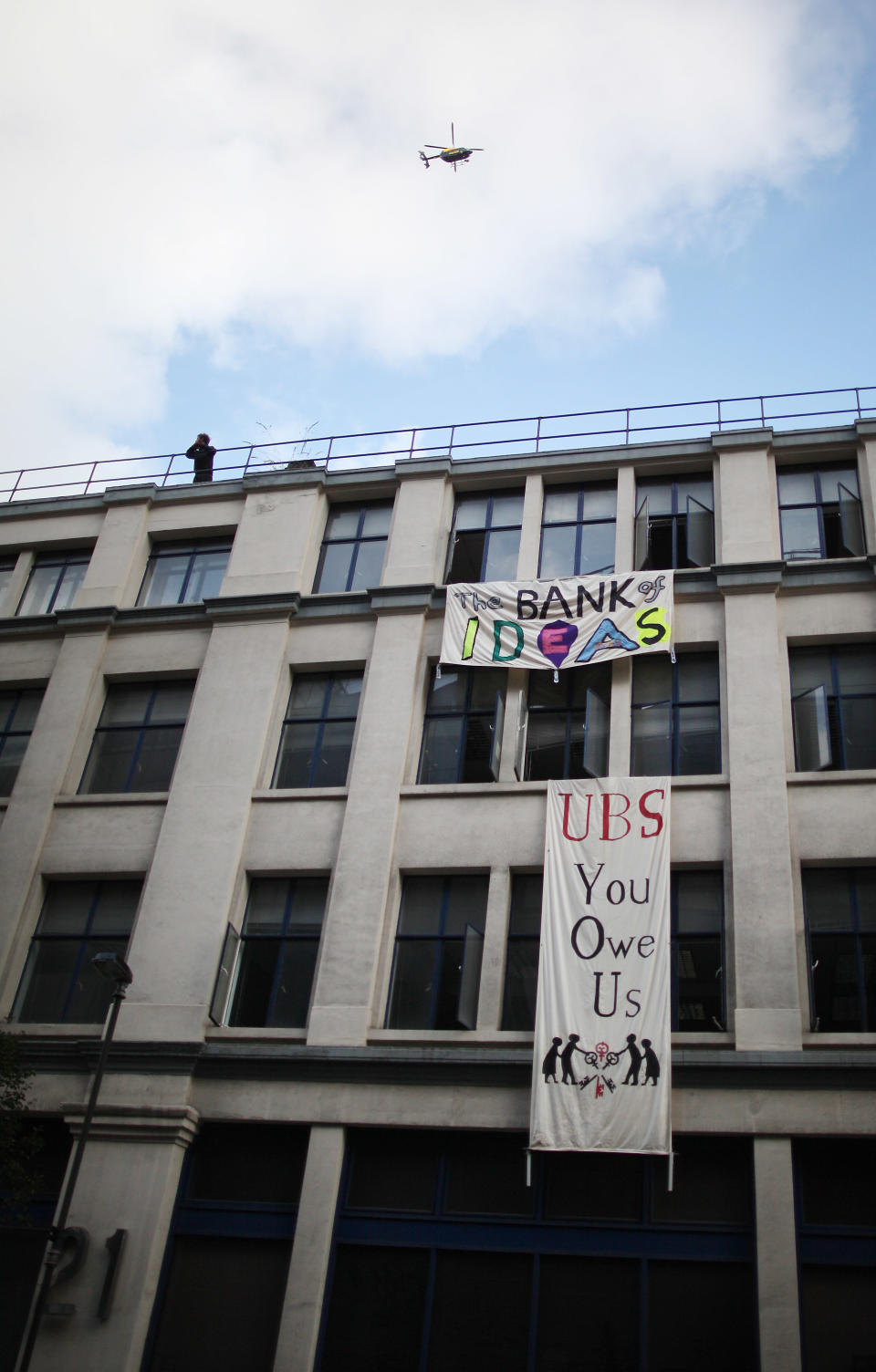Protestors Occupy An Empty Office Block Owned By UBS
