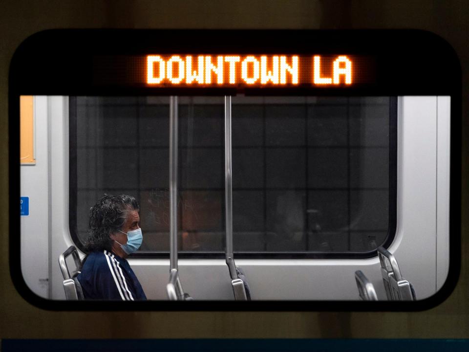 A commuter sits in a Los Angeles Metro train in Los Angeles, Wednesday, July 13, 2022.