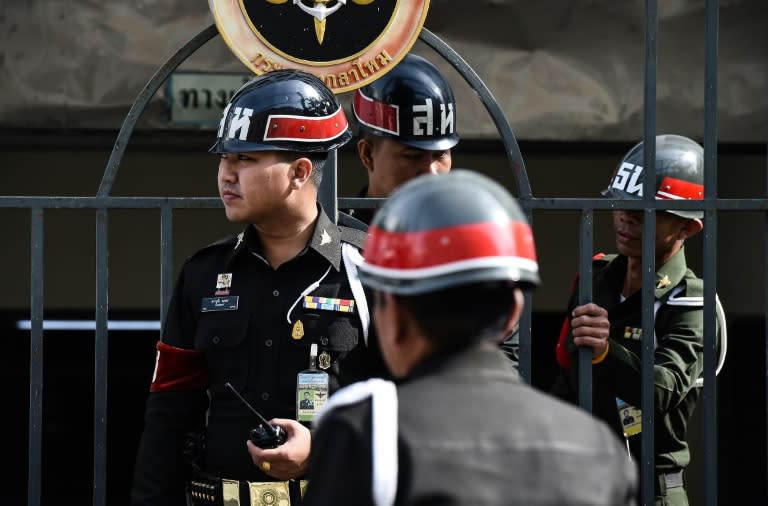 Soldiers guard the gates of a military court in Bangkok, after two Chinese nationals were brought there to stand trial for the Erawan Shrine bombings a year ago, on August 23, 2016