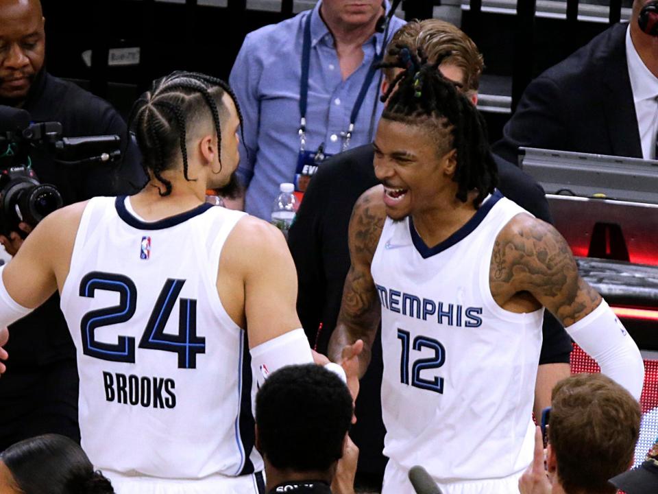 Dillon Brooks and Ja Morant celebrate together after a Grizzlies game in 2022.