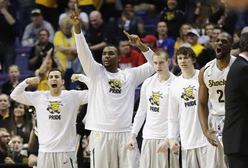 Wichita State celebrates against Cal Poly during the first half of a second-round game in the NCAA college basketball tournament Friday, March 21, 2014, in St. Louis. (AP Photo/Charlie Riedel)