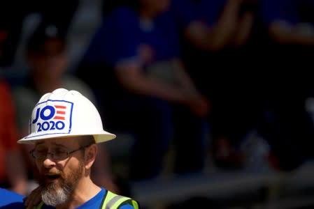 FILE PHOTO: A supporter wears a construction hard hat reading "JOE 2020" during a campaign rally for Democratic 2020 U.S. presidential candidate and former Vice President Joe Biden in Philadelphia