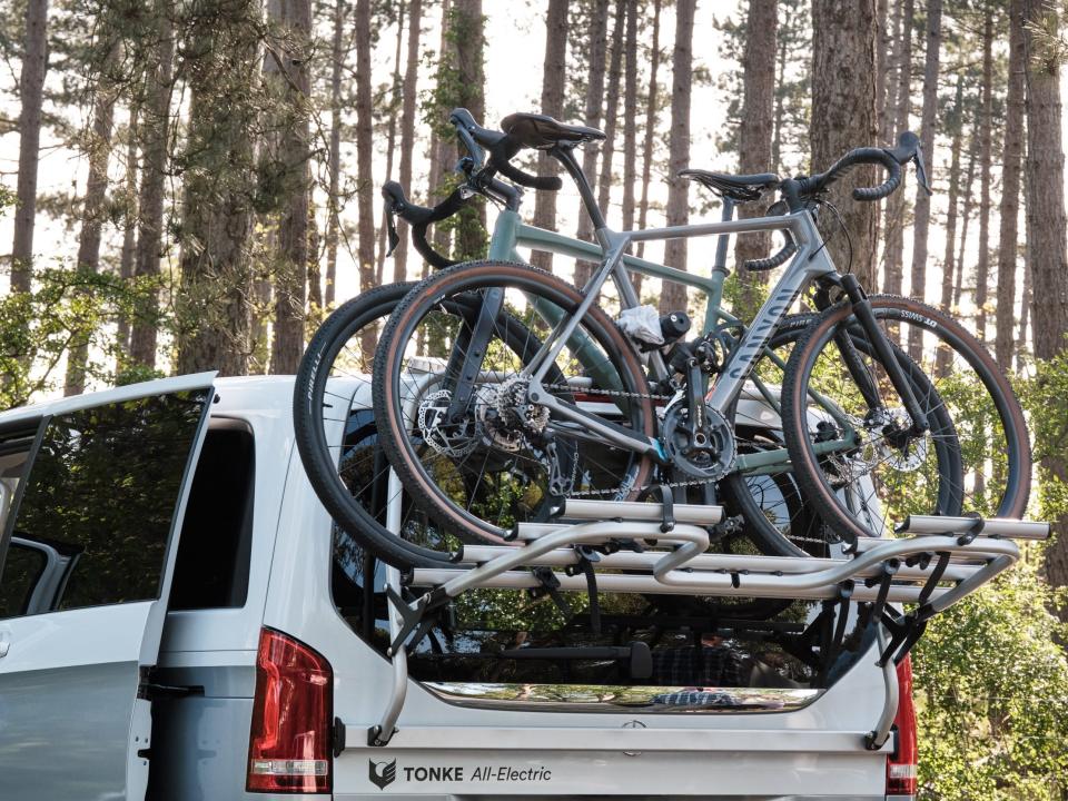 A rack of bikes attached to the rear of the van.