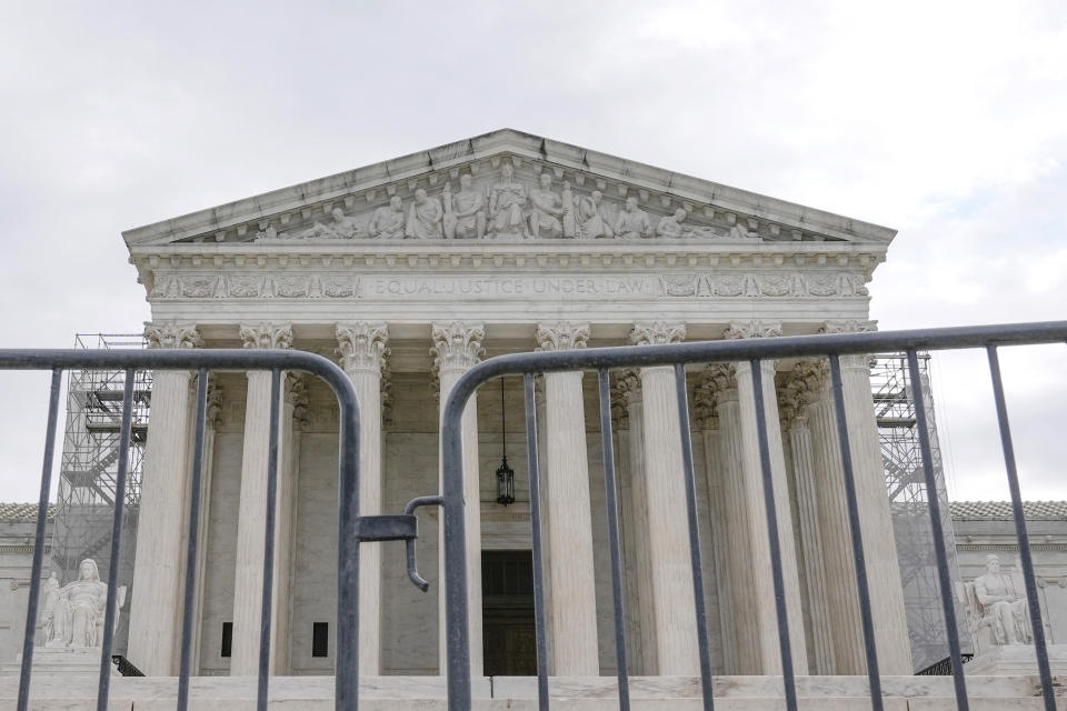 The Supreme Court is seen during a protest outside the as the justices prepare to hear arguments over whether Donald Trump is immune from prosecution in a case charging him with plotting to overturn the results of the 2020 presidential election, on Capitol Hill Thursday, April 25, 2024, in Washington. (AP Photo/Mariam Zuhaib)