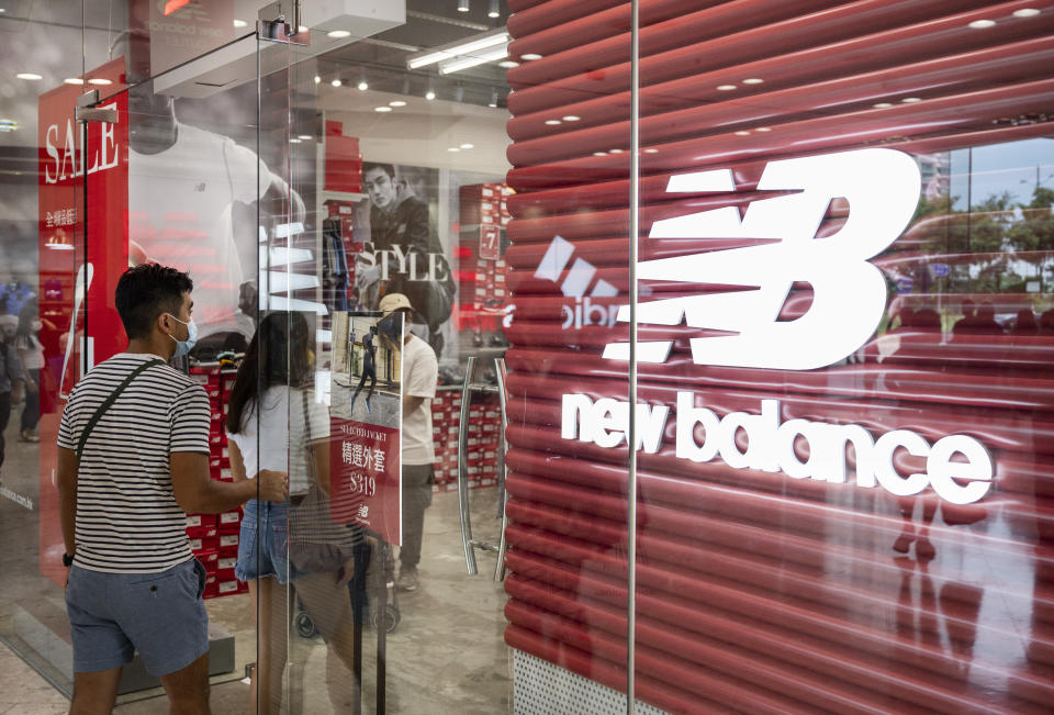 HONG KONG, CHINA - 2021/10/07: Shoppers are seen at the American footwear brand New Balance (NB) store at Tung Chung district in Hong Kong. (Photo by Budrul Chukrut/SOPA Images/LightRocket via Getty Images)