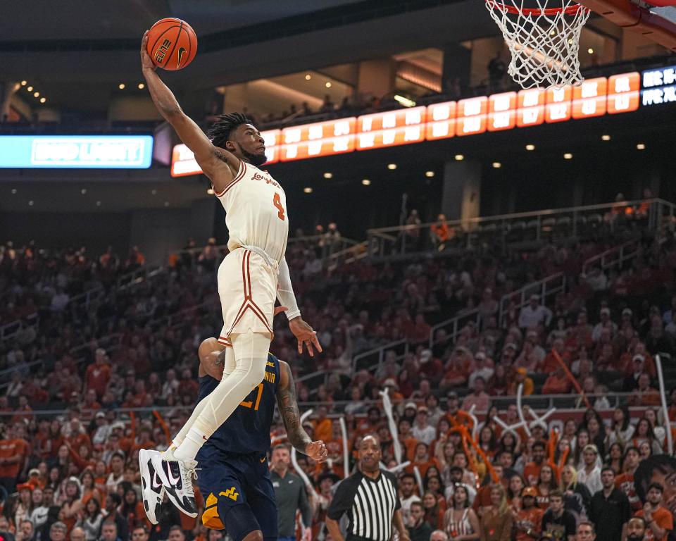 Tyrese Hunter dunks the ball during Texas' win over West Virginia at Moody Center on Saturday. Hunter broke out of a scoring slump with 19 points.
