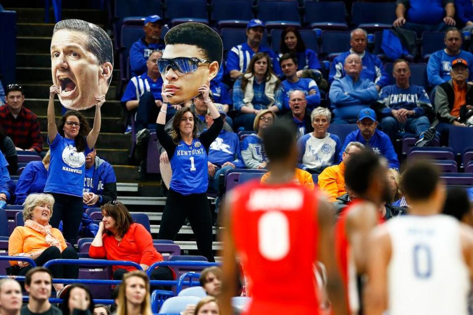 Kentucky fans cheered with cutouts of Kentucky coach John Calipari and guard Quade Green during UK’s 62-49 win against Georgia in the 2018 SEC Tournament quarterfinals in St. Louis. The 2018 SEC tourney remains the most recent won by UK.