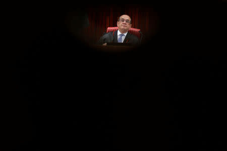 President of the Superior Electoral Court Gilmar Mendes reacts during a meeting at the Supreme Electoral Court (TSE) to debate whether to annul the Rousseff-Temer ticket in the 2014 election for receiving illegal campaign donations, in Brasilia, Brazil April 4, 2017. REUTERS/Ueslei Marcelino