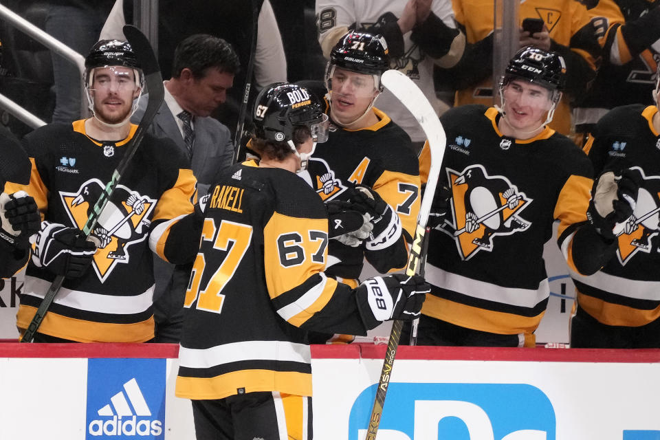 Pittsburgh Penguins' Rickard Rakell (67) returns to the bench after scoring against the Columbus Blue Jackets during the second period of an NHL hockey game in Pittsburgh, Tuesday, March 5, 2024. (AP Photo/Gene J. Puskar)