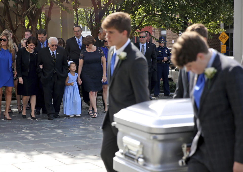 The Blanco family pallbearers bring the casket into the Cathedral as the family follows during a Celebration of Life Interfaith Service for former Louisiana Gov. Kathleen Babineaux Blanco, at St. Joseph Cathedral in Baton Rouge, La., Thursday, Aug. 22, 2019. Thursday was the first of three days of public events to honor Blanco, the state's first female governor who died after a years long struggle with cancer.(AP Photo/Michael Democker, Pool)