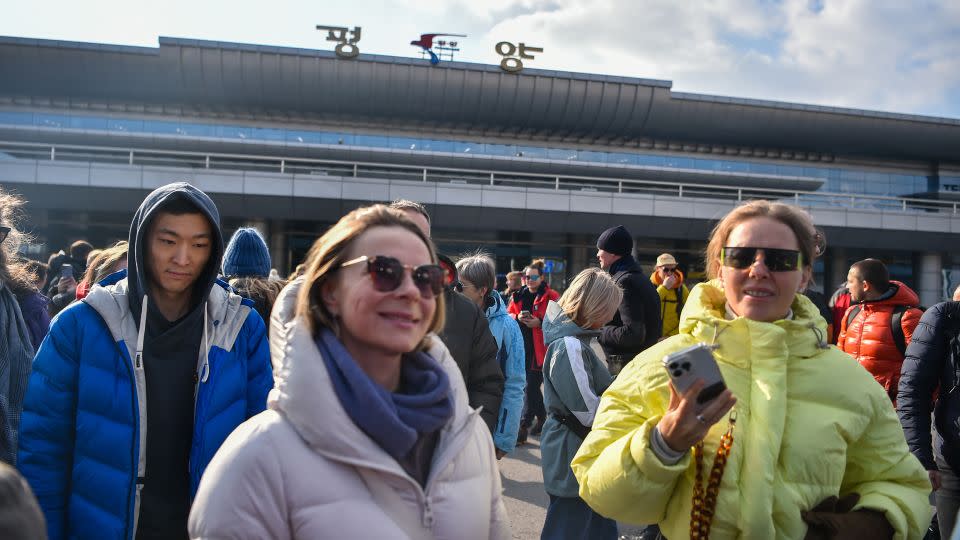 Members of the Russian tour group pictured shortly after arriving in Pyongyang. (Photo by KIM WON JIN/AFP via Getty Images) - Kim Won Jin/AFP/Getty Images