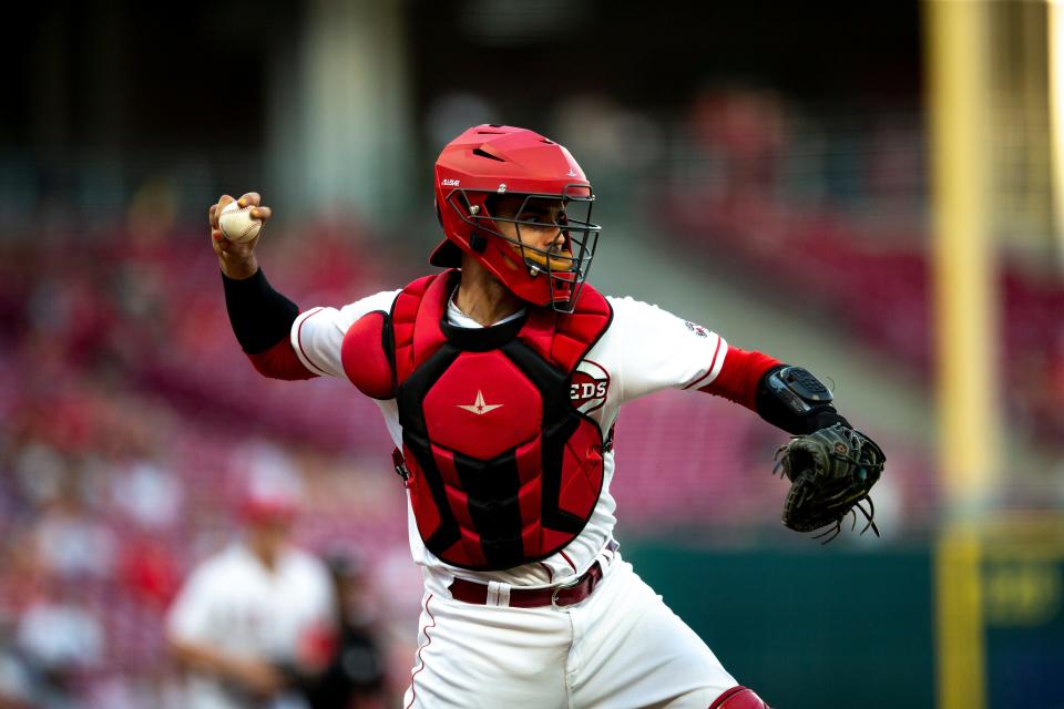 Cincinnati Reds catcher Aramis Garcia (33) throws to first after a bunt in the fourth inning of the MLB game between the Cincinnati Reds and the Los Angeles Dodgers in Cincinnati at Great American Ball Park on Tuesday, June 21, 2022. 
