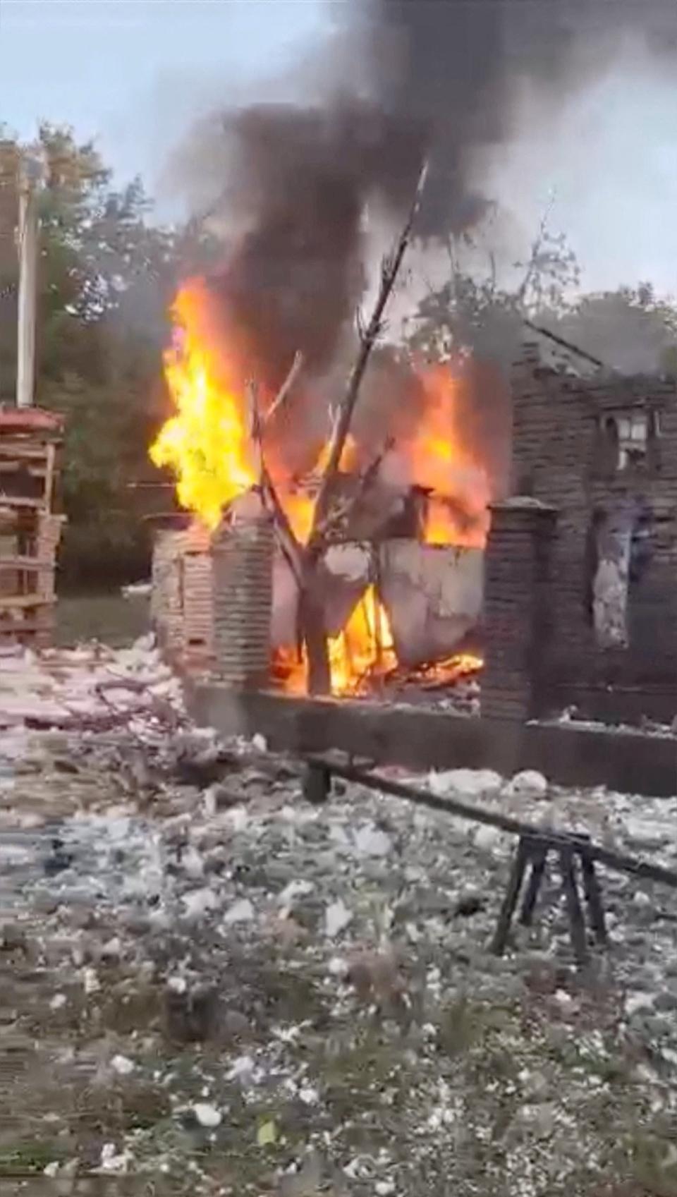 A view shows a burning damaged building in the aftermath of a Russian missile strike in Zaporizhzhia, Ukraine (via REUTERS)