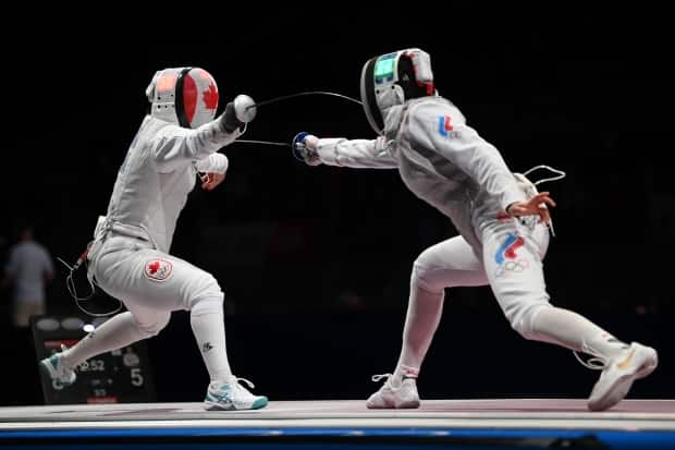 Canadian Kelleigh Ryan competes against Adelina Zagidullina of Team ROC in the third round of women's individual foil on Sunday. (Matthias Hangst/Getty Images - image credit)