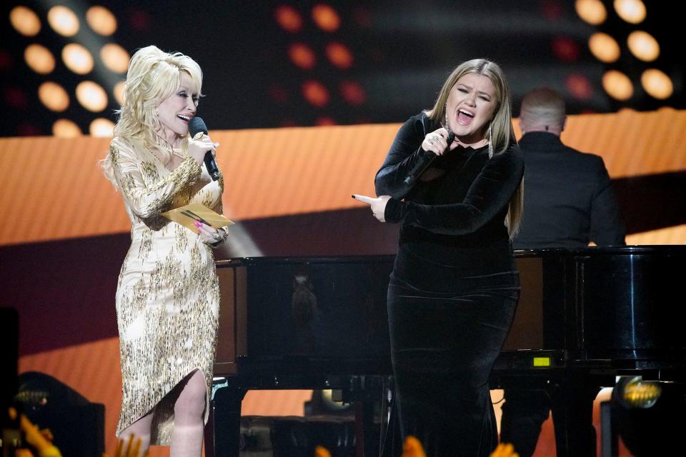 Dolly Parton appears on stage with Kelly Clarkson during the 57th Academy of Country Music Awards at Allegiant Stadium in Las Vegas, Nev., Monday, March 7, 2022.