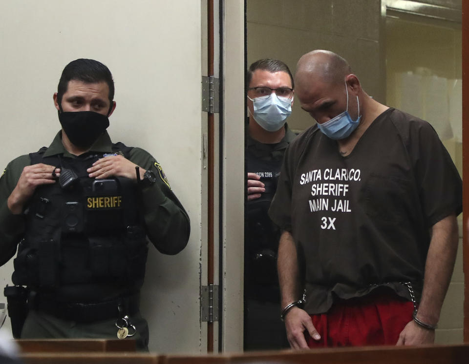 Former UFC heavyweight champion Cain Velasquez, right, makes an initial court appearance at the Santa Clara County Hall of Justice on Wednesday, March 2, 2022, in San Jose, Calif. Velasquez was arrested Monday on suspicion of attempted murder after he allegedly shot a man in Northern California, police said. (Aric Crabb/Bay Area News Group via AP, Pool)