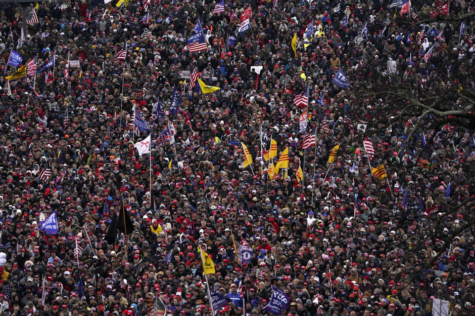 FILE - People listen as then-President Donald Trump speaks during a rally Jan. 6, 2021, in Washington. Intelligence reports compiled by the U.S. Capitol Police in the days before last year's insurrection envisioned only an improbable or remote risk of violence, even as other assessments warned that crowds of potentially tens of thousands of pro-Trump demonstrators could converge in Washington to create a dangerous situation. (AP Photo/Evan Vucci, File)