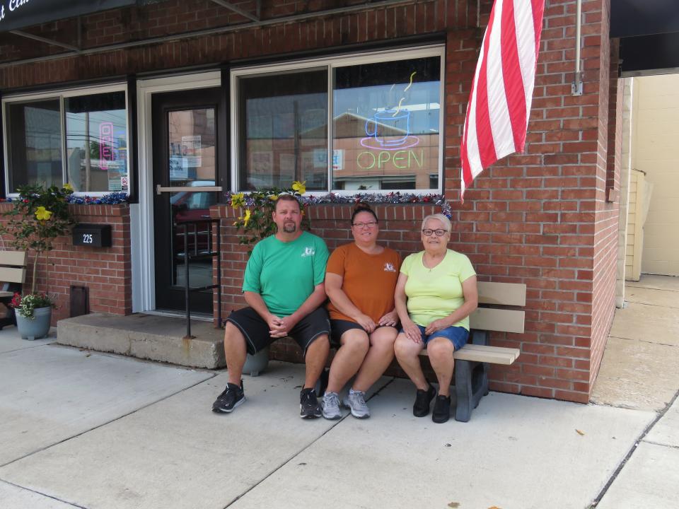 Bill and Lisa Black — and their Aunt Ellie Carte — sit out front of their restaurant, the Ala Carte Cafe in the heart of Port Clinton. Yes, the name of the restaurant is a play on words.