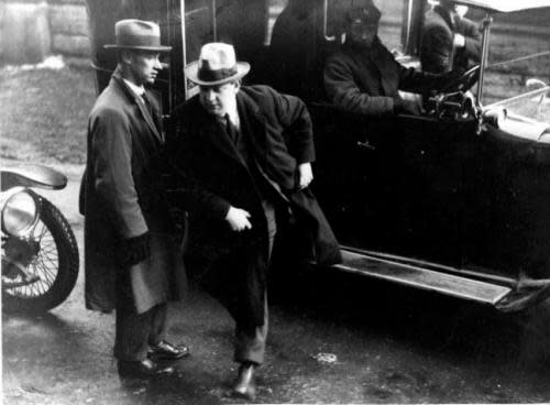 Undated photo of Michael Collins emerging from a vehicle