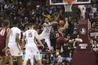 Boston College's Derryck Thornton, right is fouled while attempting a shot by Florida State's Devin Vassell in the second half of an NCAA college basketball game Saturday, March 7 2020, in Tallahassee, Fla. Florida State won 80-62. (AP Photo/Steve Cannon)