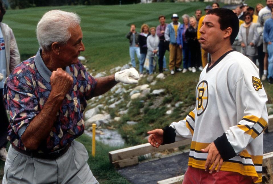 Bob Barker prepares to punch Adam Sandler in a scene from the film 'Happy Gilmore', 1996. (Photo by Universal/Getty Images)