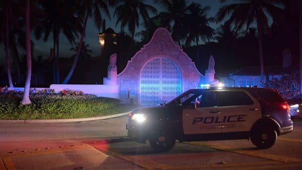 PHOTO: Authorities stand outside Mar-a-Lago, the residence of former president Donald Trump, amid reports of the FBI executing a search warrant as a part of a document investigation, in Palm Beach, Fla., Aug. 8, 2022. (Jim Rassol/EPA-EFE/Shutterstock)