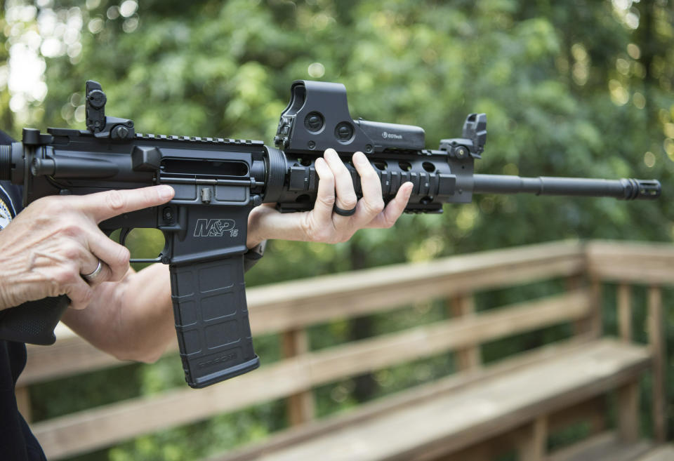 FILE - In this June 24, 2016 file photo, an AR-15 is held in Auburn, Ga. The Pittsburgh City Council gave initial approval Wednesday, March 27, 2019, to gun-control legislation introduced in wake of the 2018 synagogue massacre, an effort certain to be challenged in court by Second Amendment advocates who point out that state law doesn't allow municipalities to regulate firearms. The legislation would place restrictions on military-style assault weapons like the AR-15 rifle that authorities say was used in the Oct. 27 rampage at Tree of Life Synagogue that killed 11 and wounded seven.(AP Photo/Lisa Marie Pane, File)