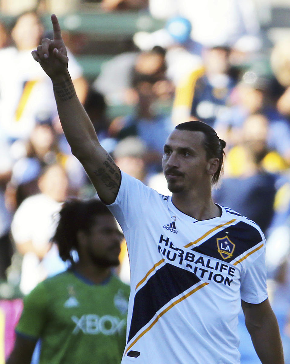 FILE - In this Sept. 23, 2018, file photo, LA Galaxy forward Zlatan Ibrahimovic (9) celebrates his goal against the Seattle Sounders in the first half of an MLS soccer match, in Carson, Calif. Zlatan Ibrahimovic is returning to the Los Angeles Galaxy. A person with knowledge of the deal confirms the 37-year-old striker will play next season for the Galaxy. The person spoke on the condition of anonymity because the team had not yet formally announced it. (AP Photo/Reed Saxon, File)