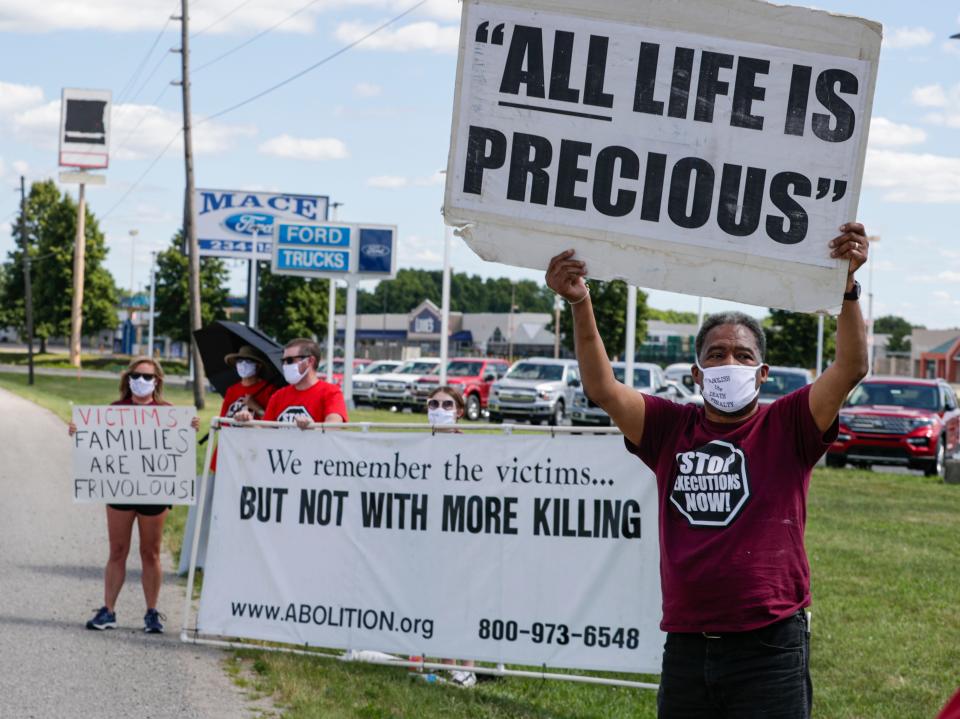 Protesters against the death penalty gather in Terre Haute, Ind., Monday, July 13, 2020, where Daniel Lewis Lee, a convicted killer, was scheduled to be executed Monday at the federal prison in Terre Haute.