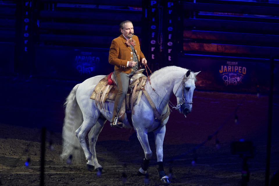 Antonio Aguilar Hijo, the son of Grammy-winning singer songwriter Pepe Aguilar, performs at his "Jaripeo Hasta Los Huesos Tour 2024" show at the Honda Center in Anaheim, Calif., on Friday, March 29, 2024. The show pays tribute to the Day of the Dead, a well-known Mexican celebration. (AP Photo/Damian Dovarganes)