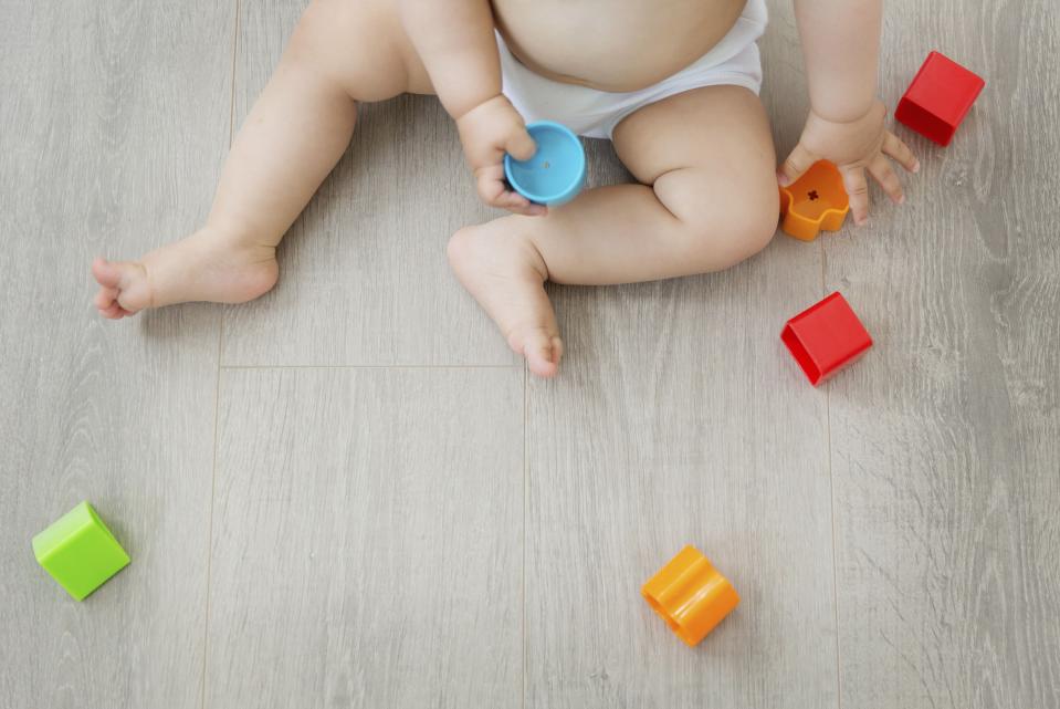 Parents and childminders can exchange information about learning, development and care of children on the app. Source: Mint Images/REX/Shutterstock