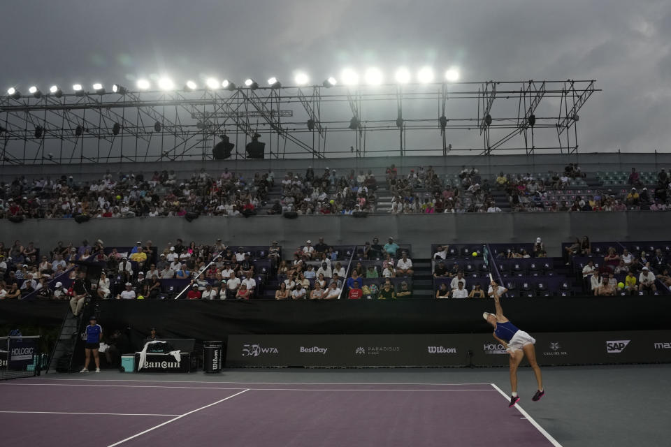 Marketa Vondrousova, of the Czech Republic, serves against Coco Gauff of the United States during a women's singles match at the WTA Finals tennis championships, in Cancun, Mexico, Friday, Nov. 3, 2023. (AP Photo/Fernando Llano)