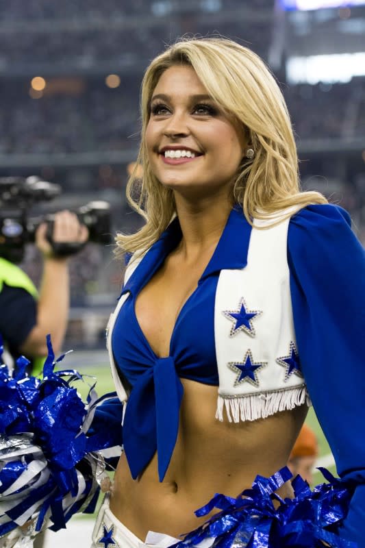 <p>The Dallas Cowboys cheerleader performs during the second half of the game against the Washington Redskins at AT&T Stadium. Mandatory Credit: Jerome Miron-USA TODAY Sports </p>