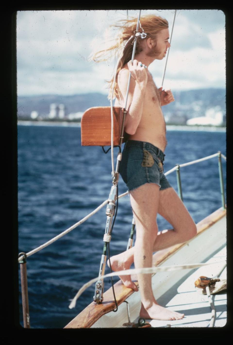 <p>A shirtless Gregg Allman leans against the ropes on a boat in 1974.</p>