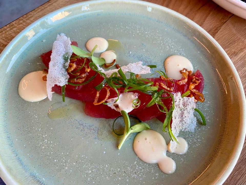 Lotte's tuna crudo appetizer is made with raw bluefin tuna, crispy shallots and puffed rice.