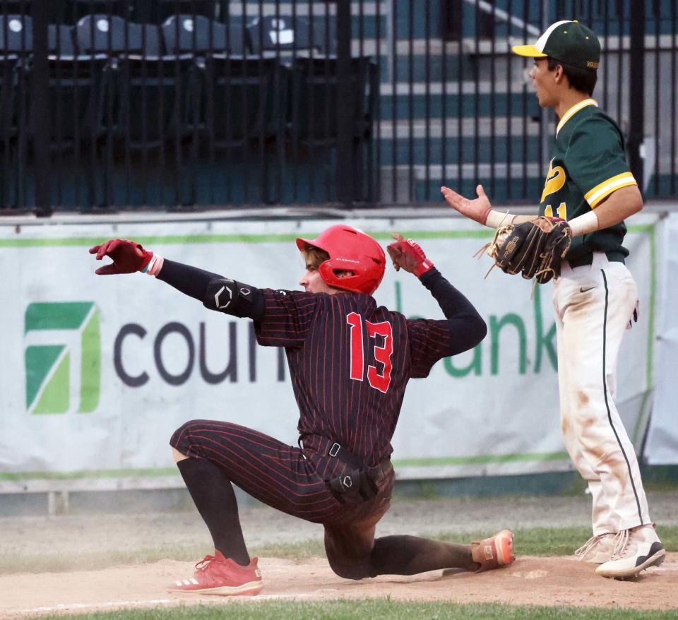 Milton's Jimmy Fallon celebrates his triple as King Philip's Sean Sullivan was late with the tag in the MIAA Division 2 state championship game at Fitton Field in Worcester on Saturday, June 18, 2022.