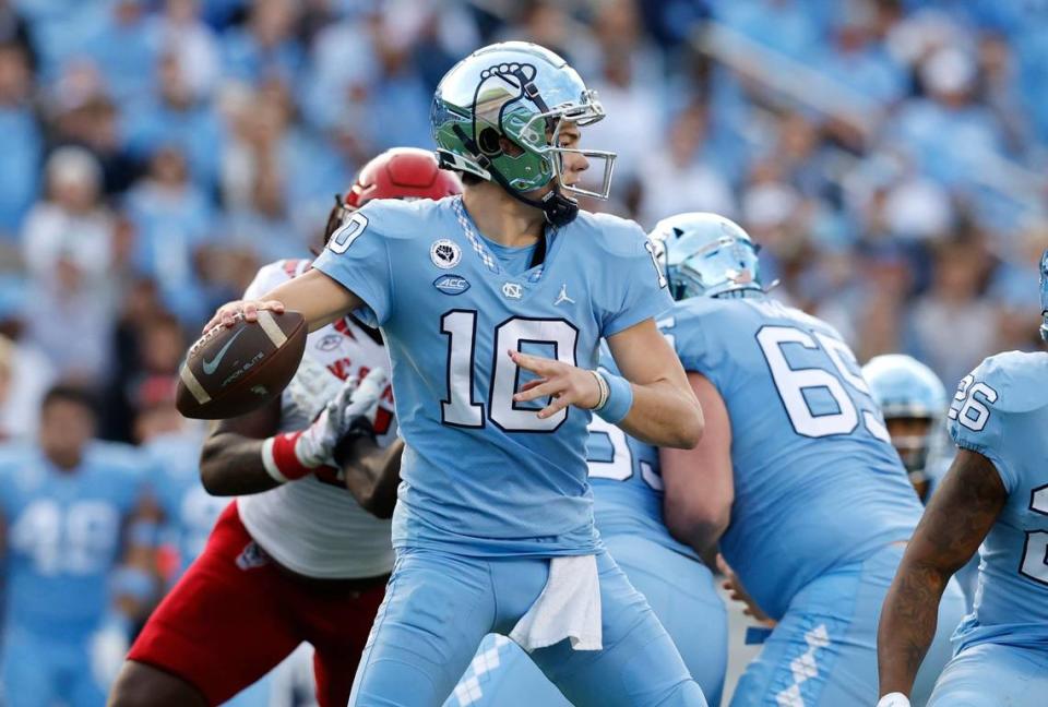 North Carolina quarterback Drake Maye (10) looks to pass during the first half of N.C. State’s game against UNC at Kenan Stadium in Chapel Hill, N.C., Friday, Nov. 25, 2022.