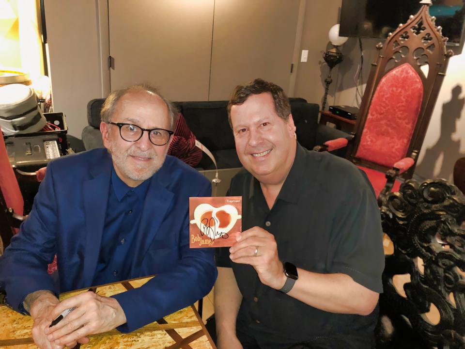 Peter Giles, a public relations and social media strategist who lives in Ridgefield, Connecticut, is shown with jazz keyboardist Bob James at the Jazz Forum Club in Tarrytown New York, on April 13, 2019. Giles holds an autographed copy of James' Espresso CD.